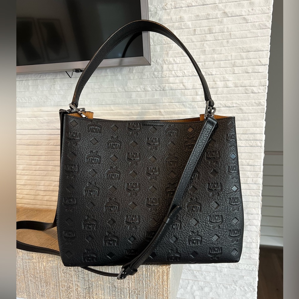 MCM embossed black shoulder bag with crossbody strap